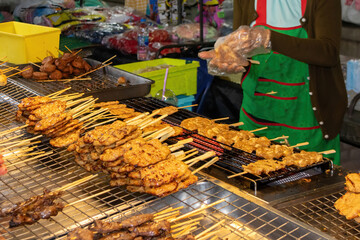 Grilled chicken for sale on a street stall in Bangkok