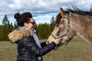 Woman with horse on ranch