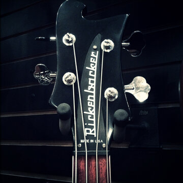 NEW YORK, USA: FEB 24 2014: scene from music retail store, close up of Rickenbacker bass guitar headstock and tuning pegs