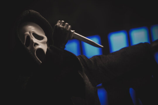 NEW YORK, USA: JAN 3 2024, Horror movie slasher Ghostface from the Scream franchise stalking with a knife - Neca action figure