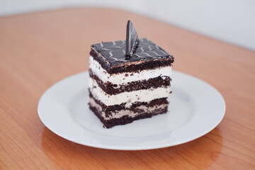 Delicious chocolate cake on a white plate