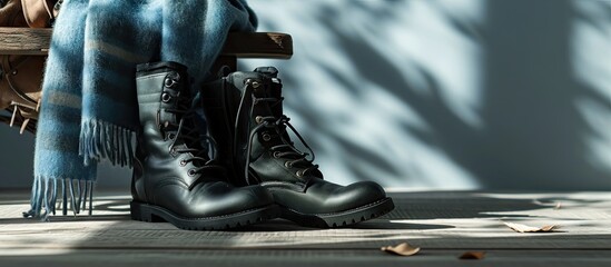 Pair of female black boots and handbag with blue shawl. with copy space image. Place for adding text or design