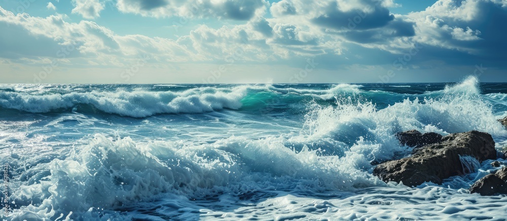 Poster Seascape A stunning seascape of the vast ocean with crashing waves and a clear blue sky. with copy space image. Place for adding text or design
