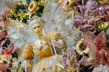 christmas golden fairy decoration with pink and gold flowers