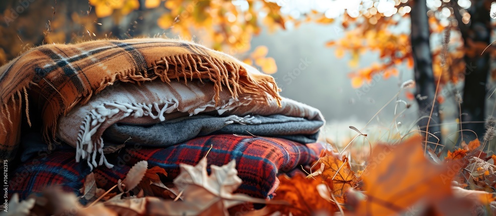 Poster Stack of woolen checked blankets autumn and winter concept banner size. with copy space image. Place for adding text or design