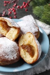 Delicious sweet buns with jam on table, closeup