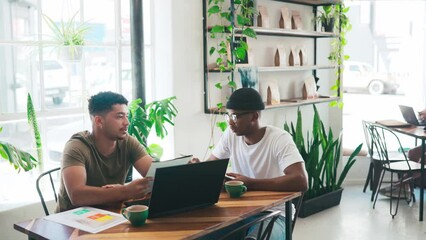 Business people, laptop and coffee shop meeting, planning and documents for startup ideas, sales or data analysis. Young entrepreneur or friends at a cafe or restaurant with computer for remote work - Powered by Adobe