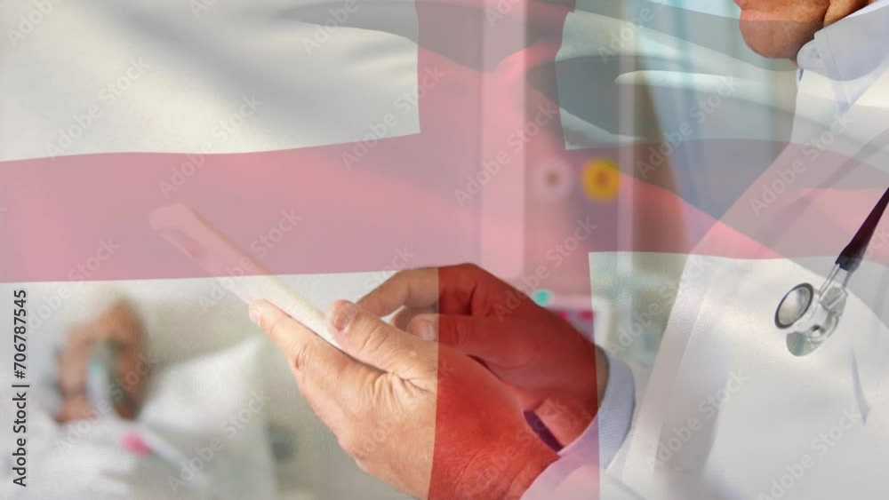 Canvas Prints Animation of flag of england over caucasian male doctor in hospital