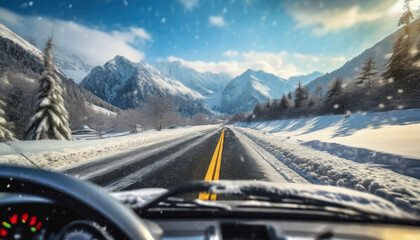 Snowy winter road in the mountains. Winter landscape with snowfall. Driving a car on a winter road through snow covered mountains.