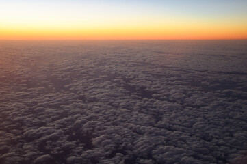 Obraz premium sunrise over the sea from airplane