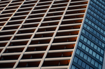 Sky rise reflecting blue and orange light.