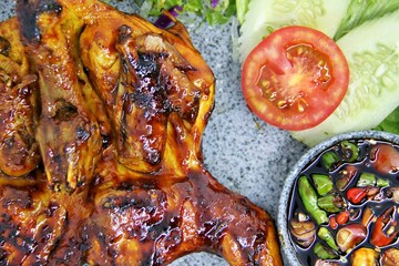 Bakakak Hayam or Ayam Bekakak or Grilled Whole Chicken with seasonings plus soy sauce, a dish from...