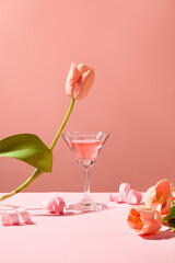 Pink background featured a cocktail glass with tulip flowers and paper fireworks. A holiday is a period of time during which you relax and enjoy yourself