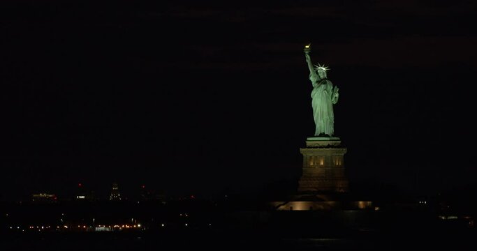Statue of Liberty and Harbor Lights at Night