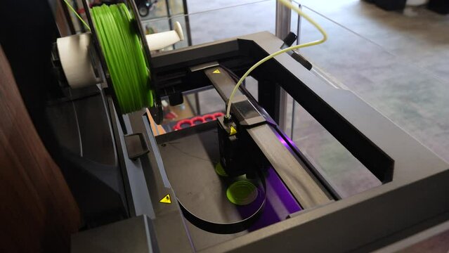 Ultramodern 3D printer working on a project. Close-up shot
