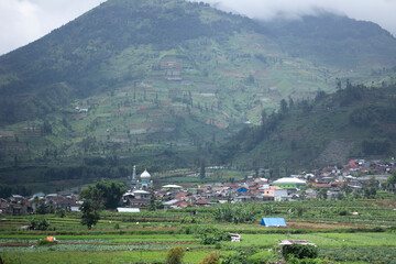 Fototapeta na wymiar Banjarnegara, January 10, 2024 residents' houses under the mountains
