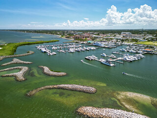 Rock jetties protecting the downtown Fort pierce boat harbor on the Treasure Coast of Florida in...
