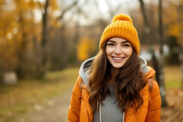 Portrait of happy woman with autumn outdoors