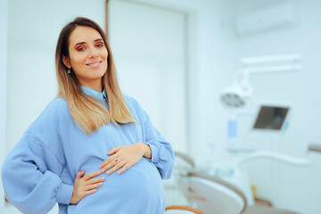 Happy Pregnant Woman Smiling in a Dental Office. Cheerful mother to be ready for a check up at the...