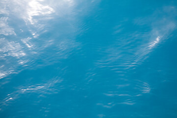 Fototapeta na wymiar Clear blue tropical ocean surface background with sunlight reflection, Palau