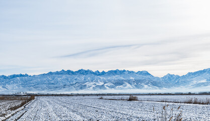 Panorama of a snow-covered mountain valley in Kyrgyzstan.