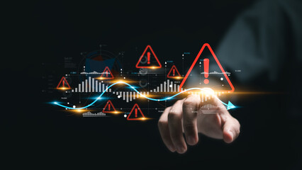 Businessman touching virtual world economic growth chart with red warning sign for caution in investing economic situation warning, Business investment risks.