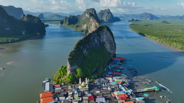 aerial view of famous floating fishing village at Koh Panyee in Thailand, flying above a tourist destination in Phang Nga Bay, Thailand