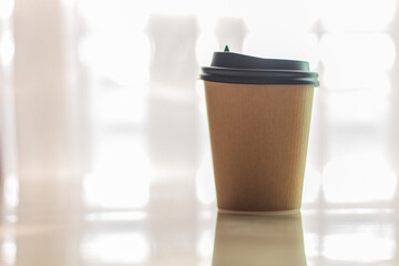 Paper cup coffee with nature light