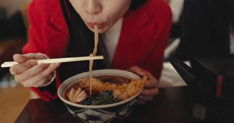 Woman, mouth and eating ramen in restaurant for dinner, meal and noodles in cafeteria. Closeup,...