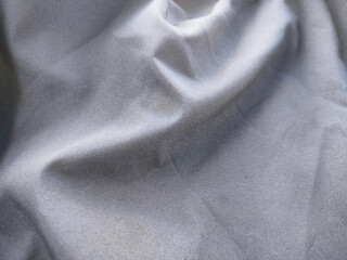 soft dark gray fabric texture background. Black blue abstract background. Shiny fabric. Dark. Wavy soft pleats. soft gray elegant luxury background. Liquid wave effect. Gradient.