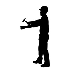 Silhouette of a worker carrying hammer tool. Silhouette of a worker in action pose using hammer tool.