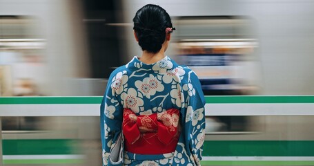 Japan woman, travel and train station in kimono and public transportation on metro bullet in city. Person, motion blur or traditional clothes by fast vehicle or subway in tokyo on urban adventure - obrazy, fototapety, plakaty