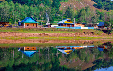 the beautiful village of Kutanovo Burzyansky district in the Republic of Bashkortostan on the banks of the Belaya River surrounded by the Ural Mountains on a summer day