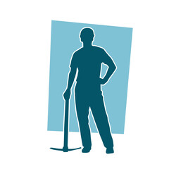 Silhouette of a man in worker costume carrying pick axe tool in action pose.