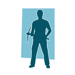 Silhouette of a man in worker costume carrying pick axe tool in action pose.