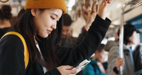 Japanese woman, online and train on smartphone, social media and public transportation on metro bullet. Person, cellphone and travel on fast vehicle for weekend trip and commute in tokyo on adventure - obrazy, fototapety, plakaty