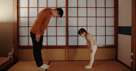 Traditional, home and Japanese father and child bow for greeting ceremony, ritual and respect....
