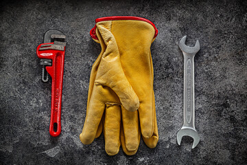 Open End Wrench And Adjustable Spanner Near Working Gloves.