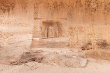 Pagan Nabatean altar carved into wall of gorge Al Siq in the Nabatean kingdom of Petra in Wadi Musa...