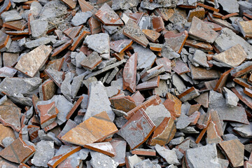 Piles of broken floor tiles from house renovations