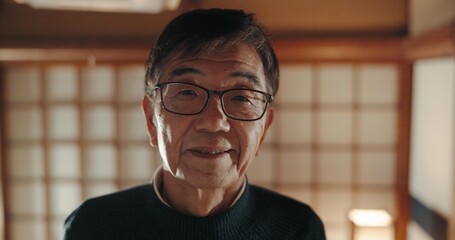 Smile, portrait and senior Japanese man at his home with positive, good and confident attitude....