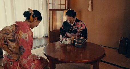 Culture, home and Japanese women with tea, leaves and herbs in traditional tearoom. Friends,...
