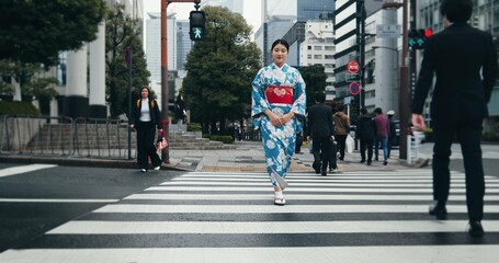 Woman, Japanese traditional dress and walking in city, zebra crossing and travel with journey outdoor. Fashion, adventure and urban street in Kyoto, kimono for culture and style with local trip