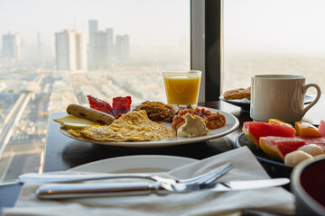 breakfast at hotel with Arabic food on the background of a beautiful view of the sights of Dubai....