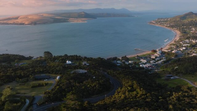 Aerial: The towns of Omapere and Opononi in the the Hokianga Harbour at sunset, Northland, New Zealand.