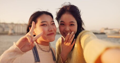 Women, friends and selfie at sea holiday in Japan for travel experience, adventure or happy. Female people, peace sign and face for city tour trip or online connection for summer, social or vacation