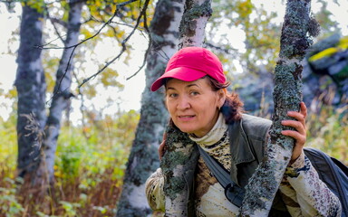 beautiful mature woman travels through the mountains of the Southern Urals