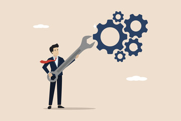 Adjustment and optimization for business improvement, repair and maintenance concept, businessman holding wrench to adjust gear cogwheels setting.