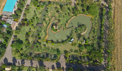 Bird's eye view of fish shape pond in botanical garden in Thailand