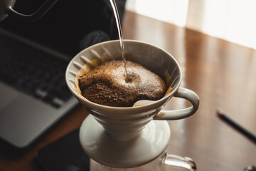 Drip coffee on your work desk in the morning